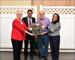 MDOT SHA Office of Materials Technology (OMT) accepts their award. From left: Becky Smith, Chandra Akisetty, Mike Moses (Paving Expert), and Sejal Barot